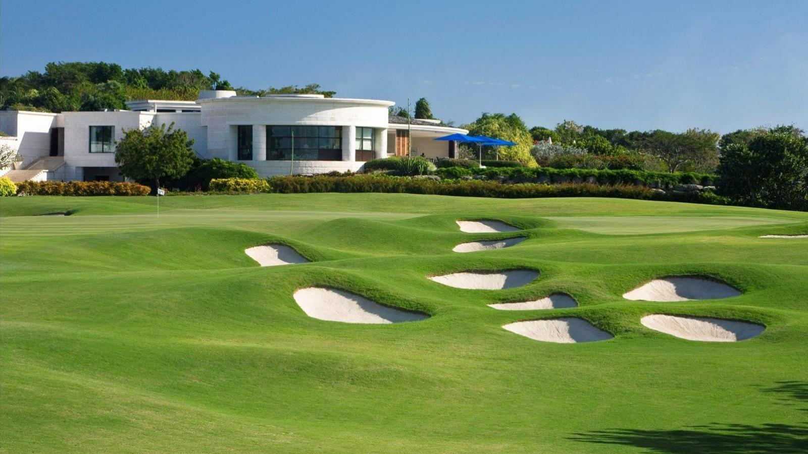 A smooth green surrounded by sand bunkers