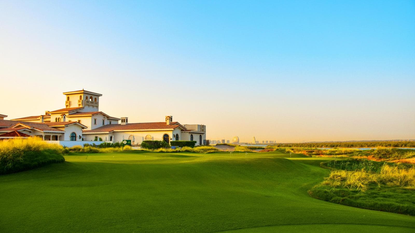 A well maintained fairway leading towards the clubhouse in Abu Dhabi
