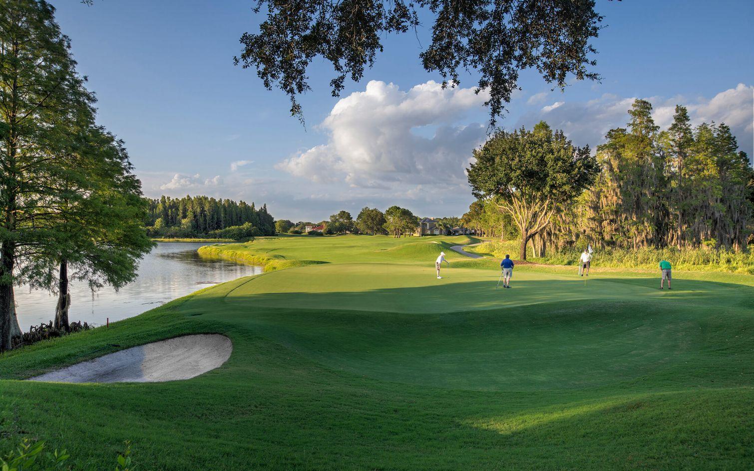 A well maintained fairway nestled with sand bunkers