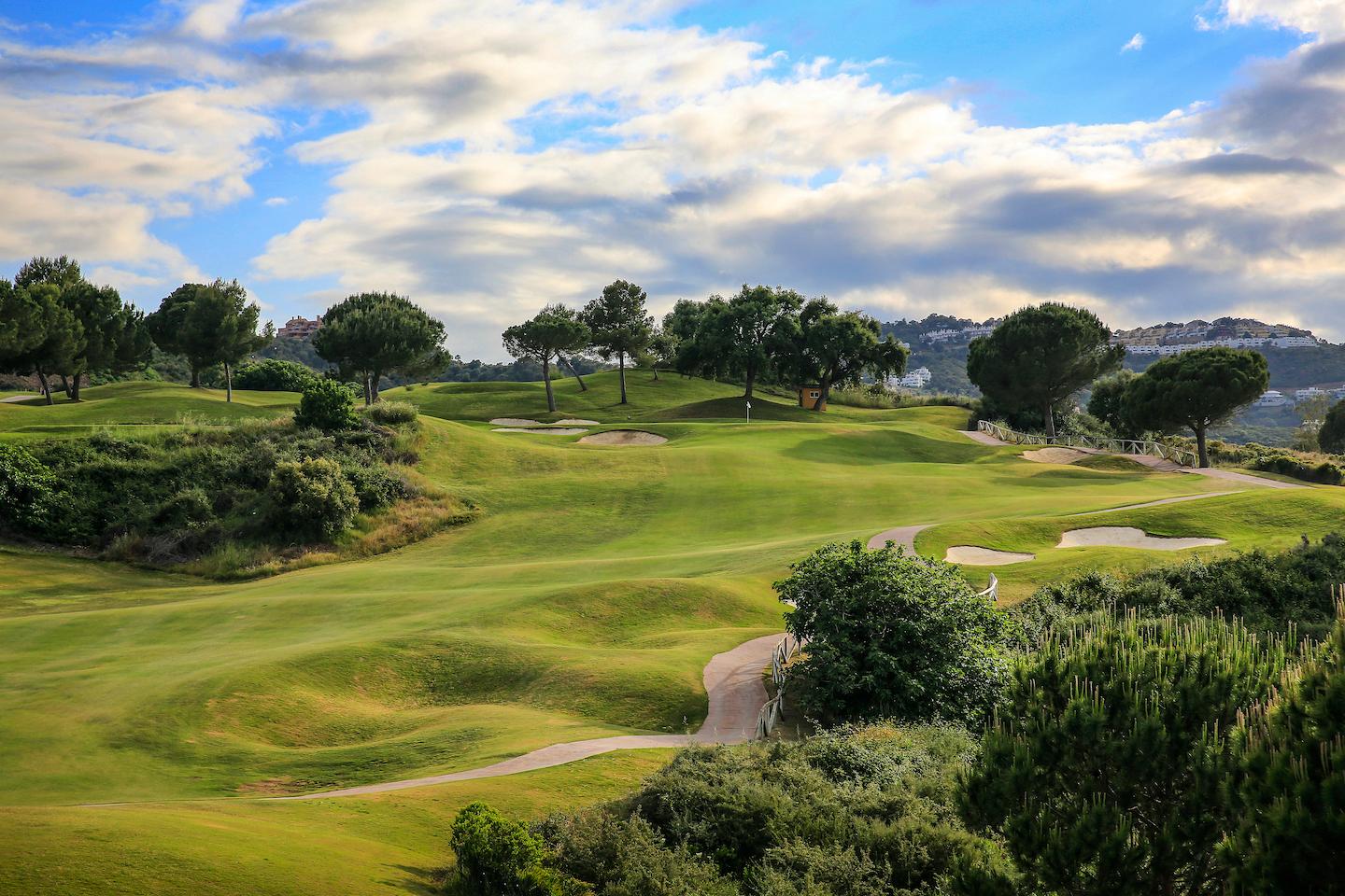 A well maintained fairway under cloudy skies at La Cala Golf Resort - Rentals