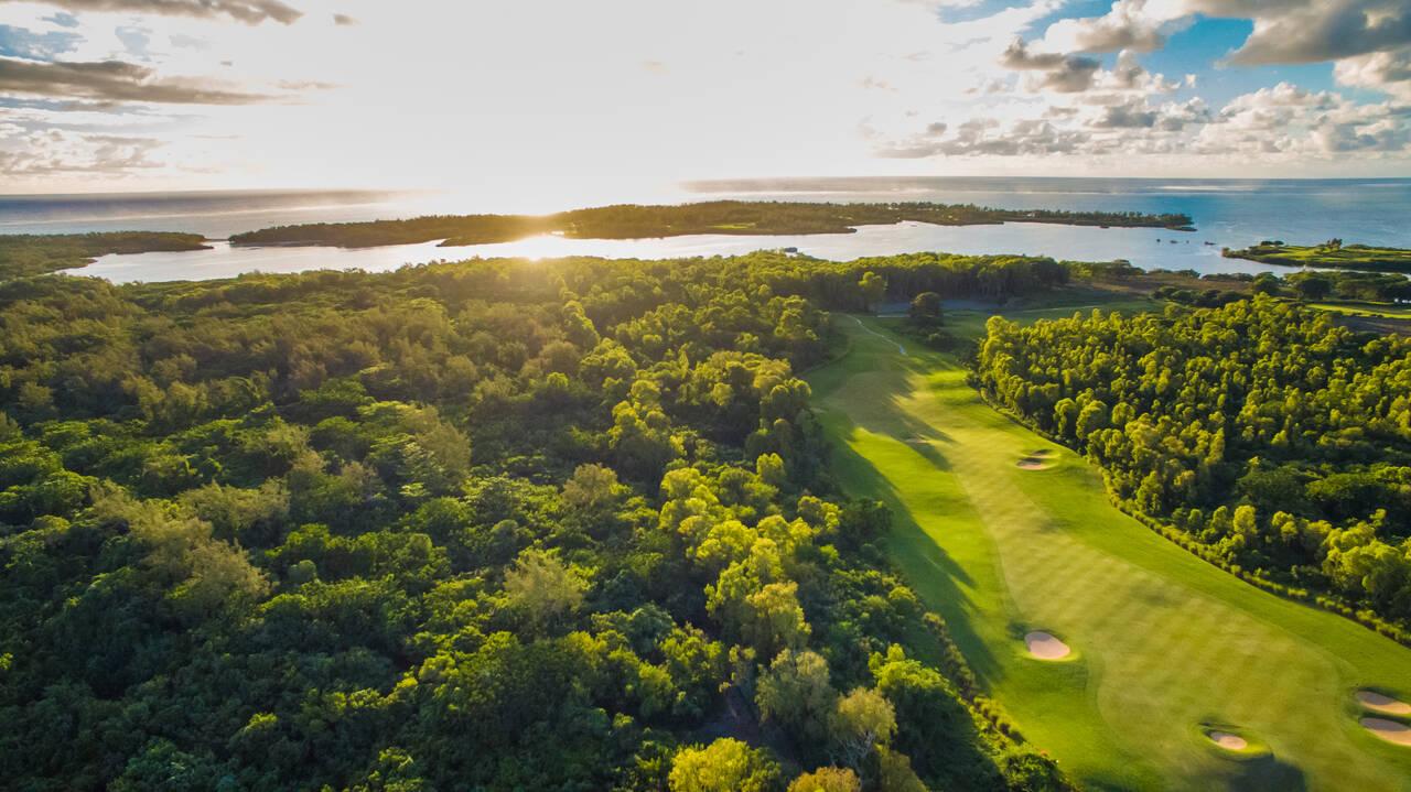 Overhead view of a well maintained fairway nestled with sand bunkers