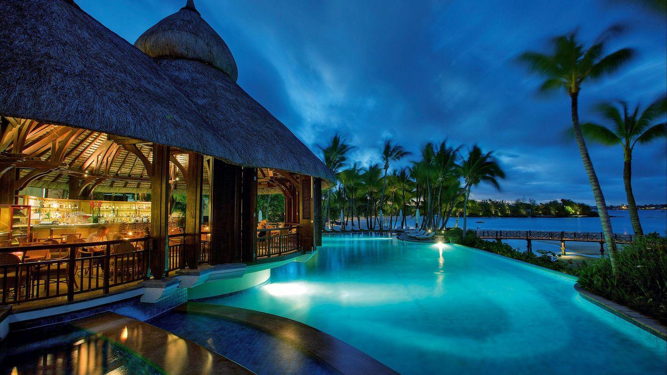 The Shangri La Touessrok outdoor swimming pool at evening