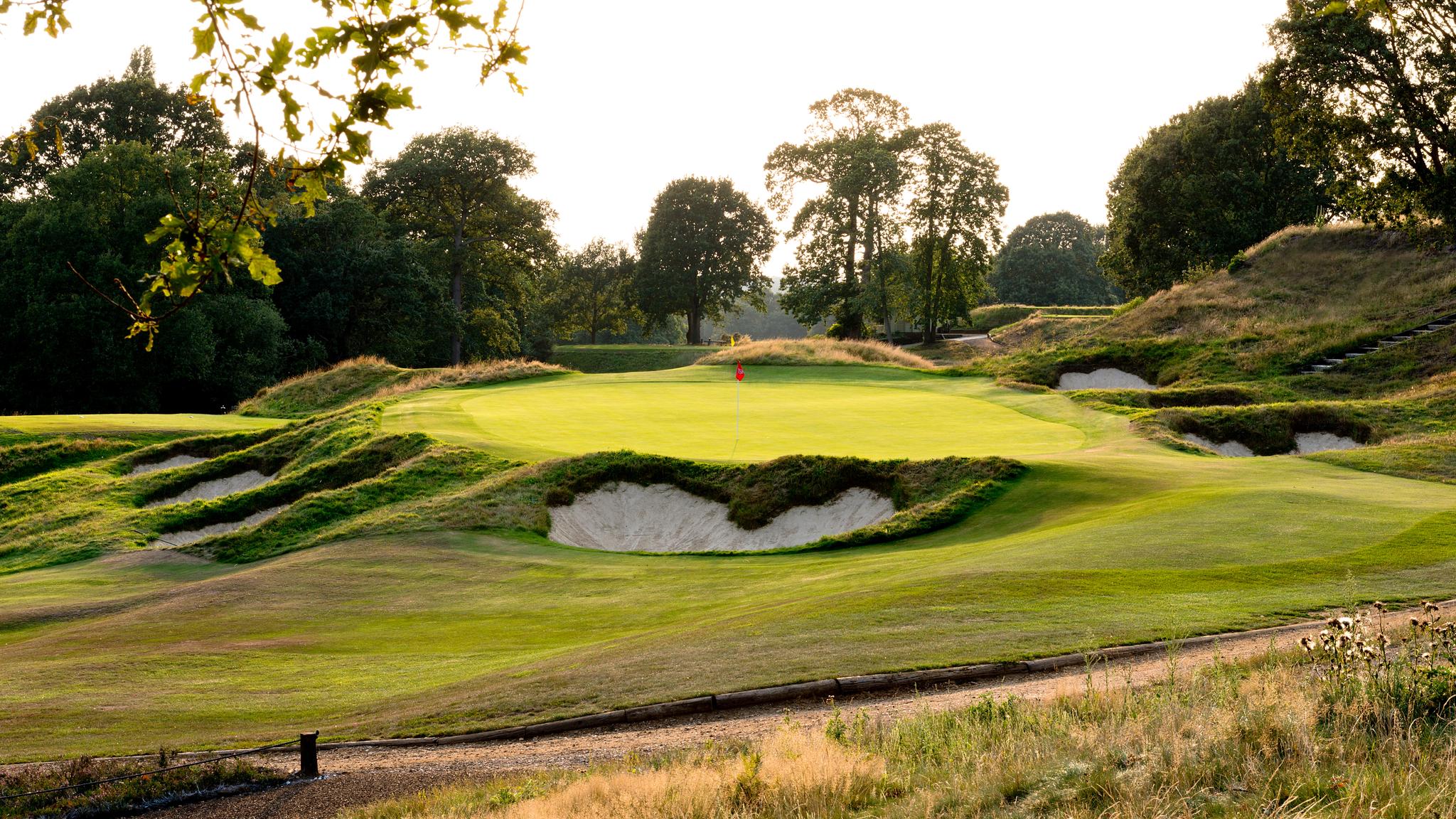 An elevated green surrounded by sand bunkers