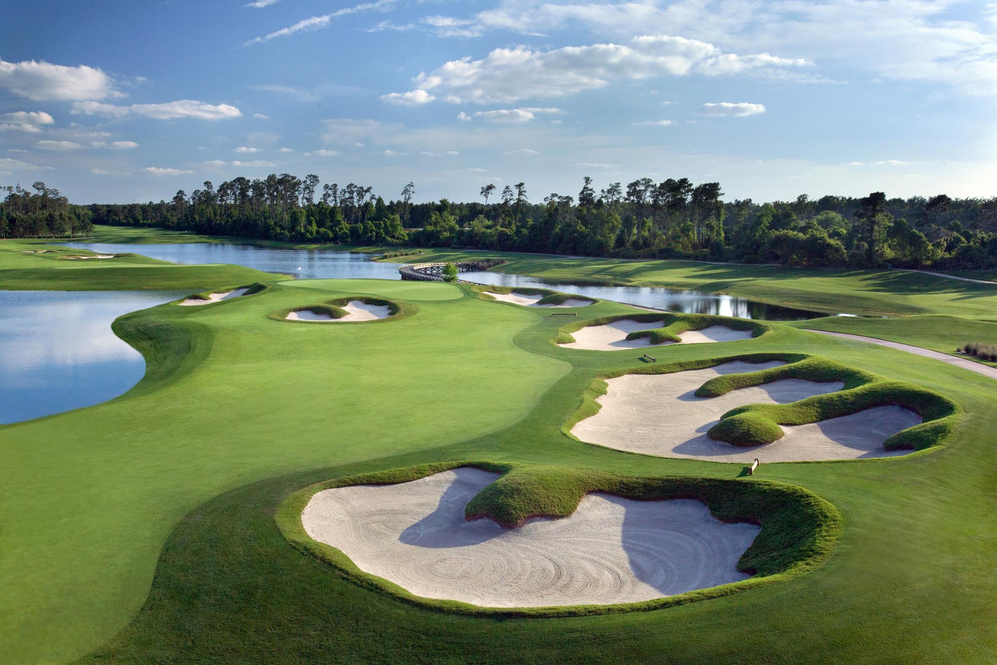 A manicure green surrounded by sand bunkers