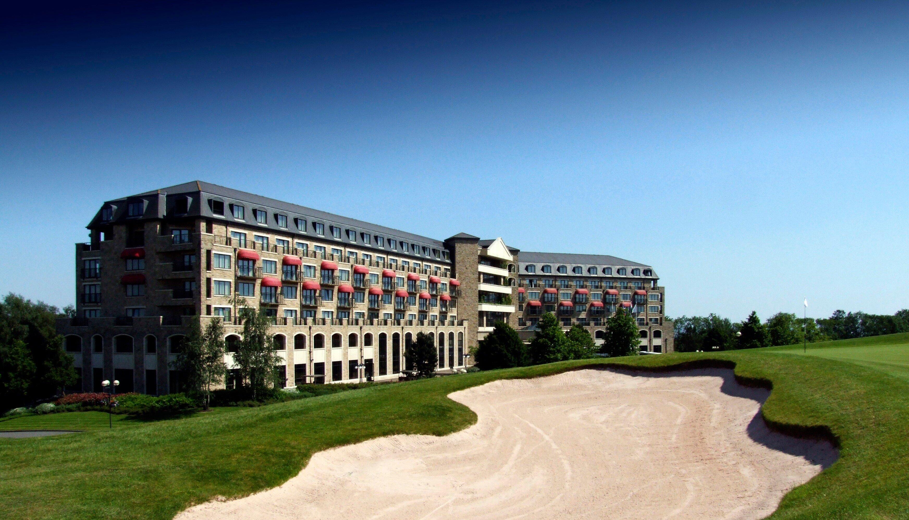 Panoramic view of the Celtic Manor Resort with a sand bunker outside