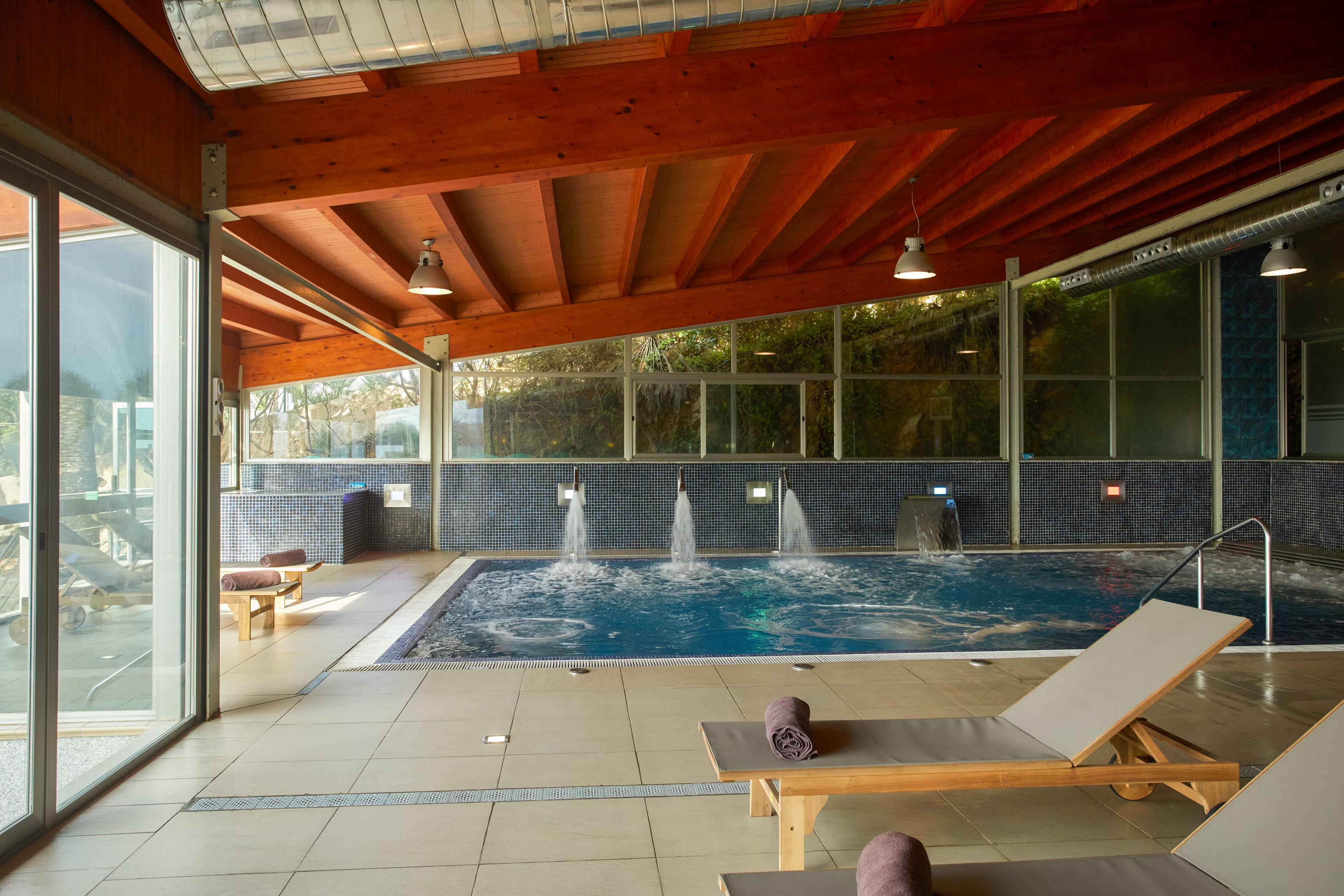 Indoor swimming pool at Inmood Aucanada Hotel
