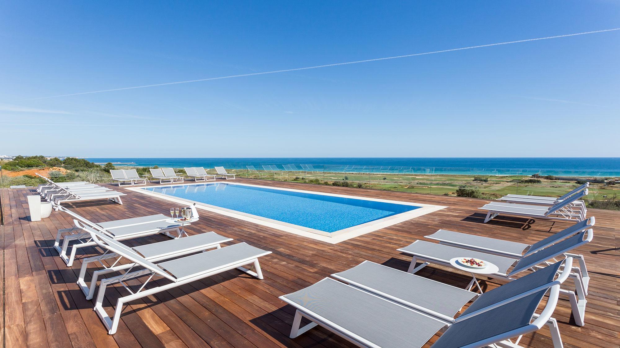 Outdoor pool area at the Palmares Beach House Hotel