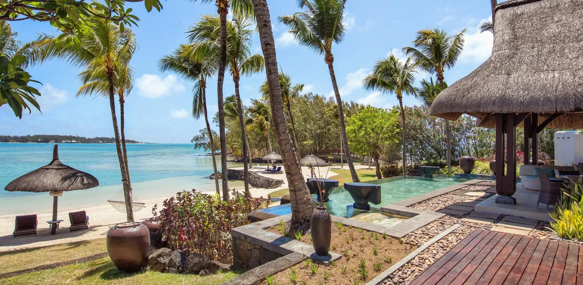 Outdoor swimming pool with ocean views at Shangri La Touessrok