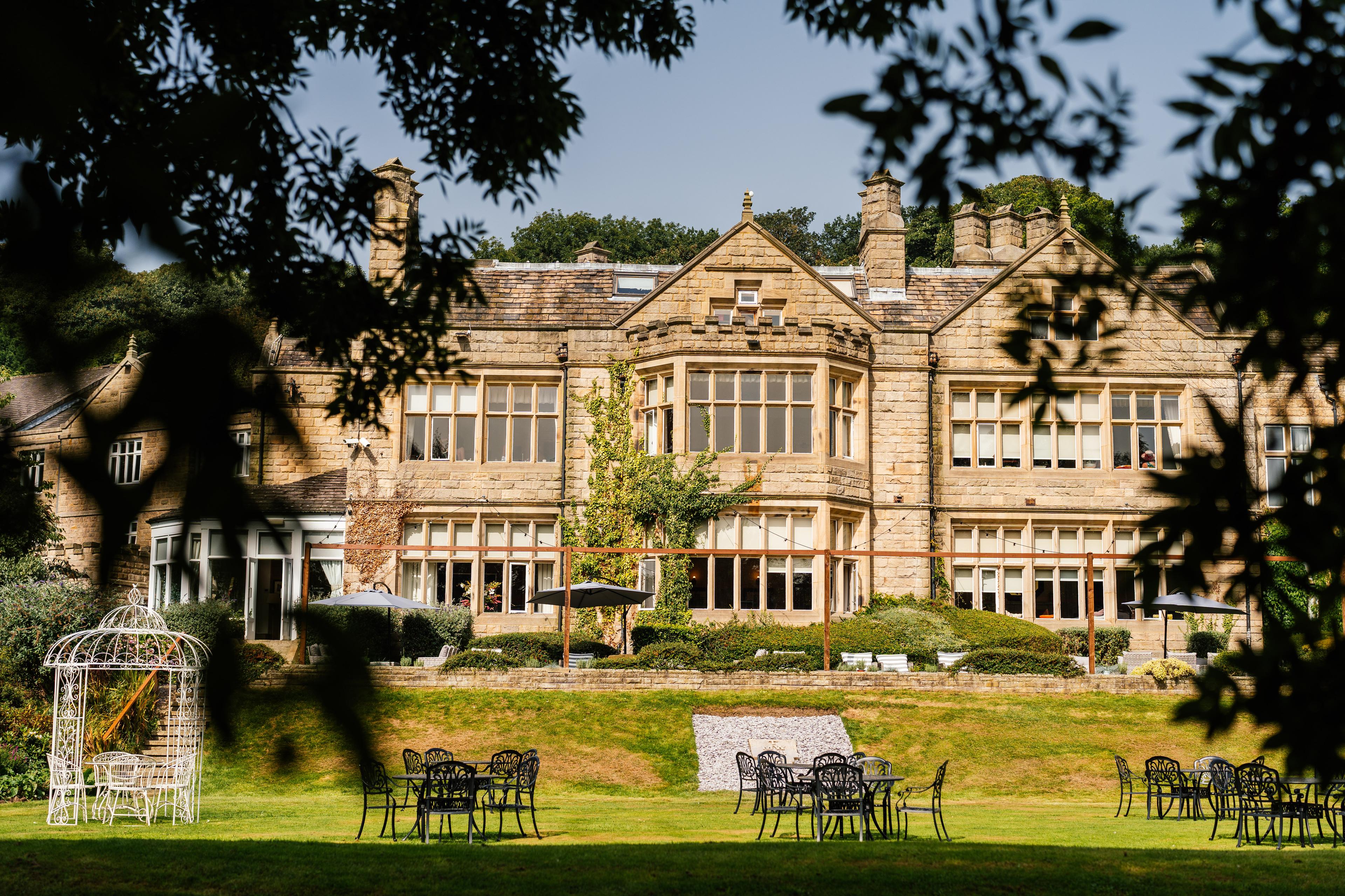 Panoramic view of Hollins Hall Hotel & Country Club through the trees