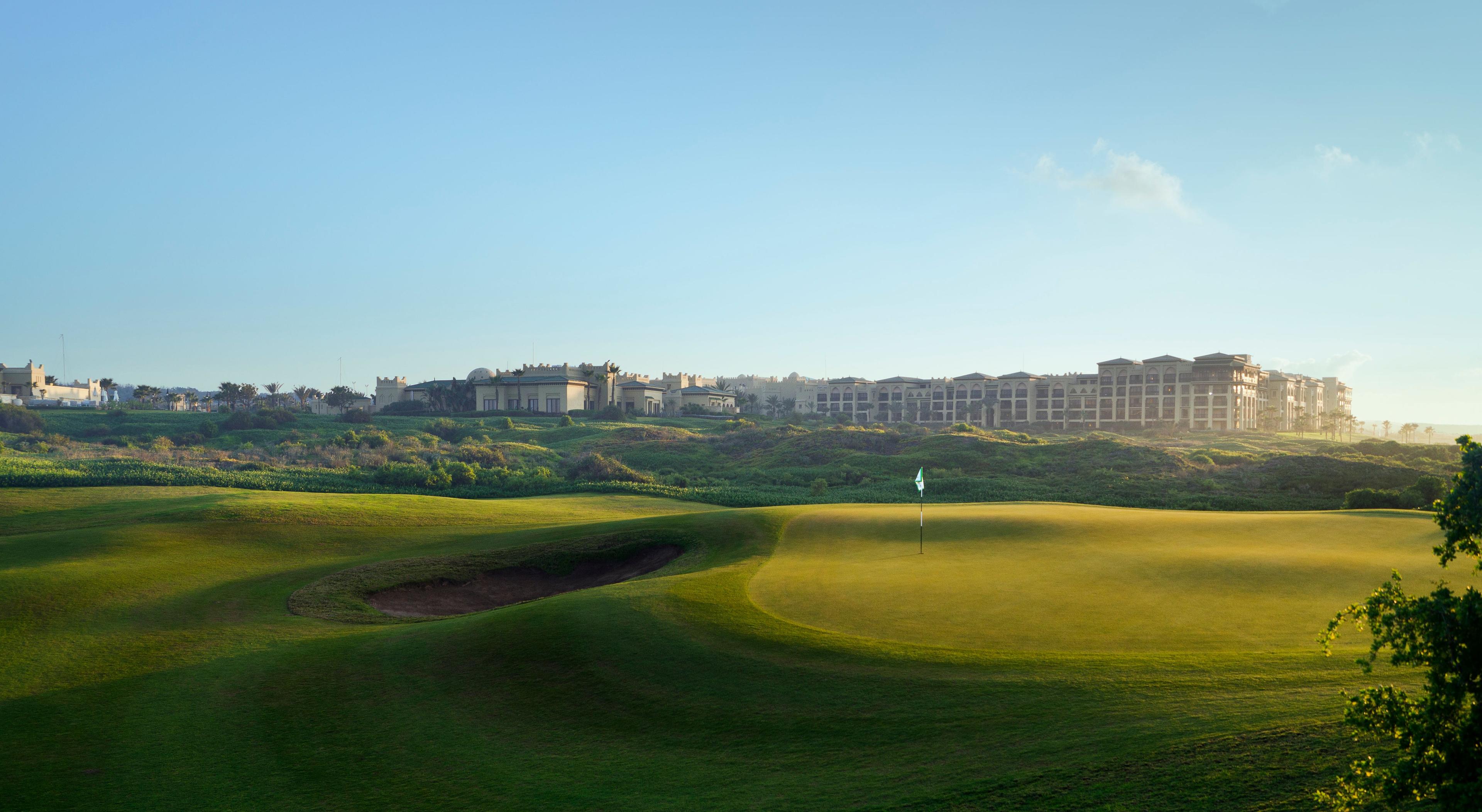 Panoramic view of a well maintained fairway leading to a smooth green