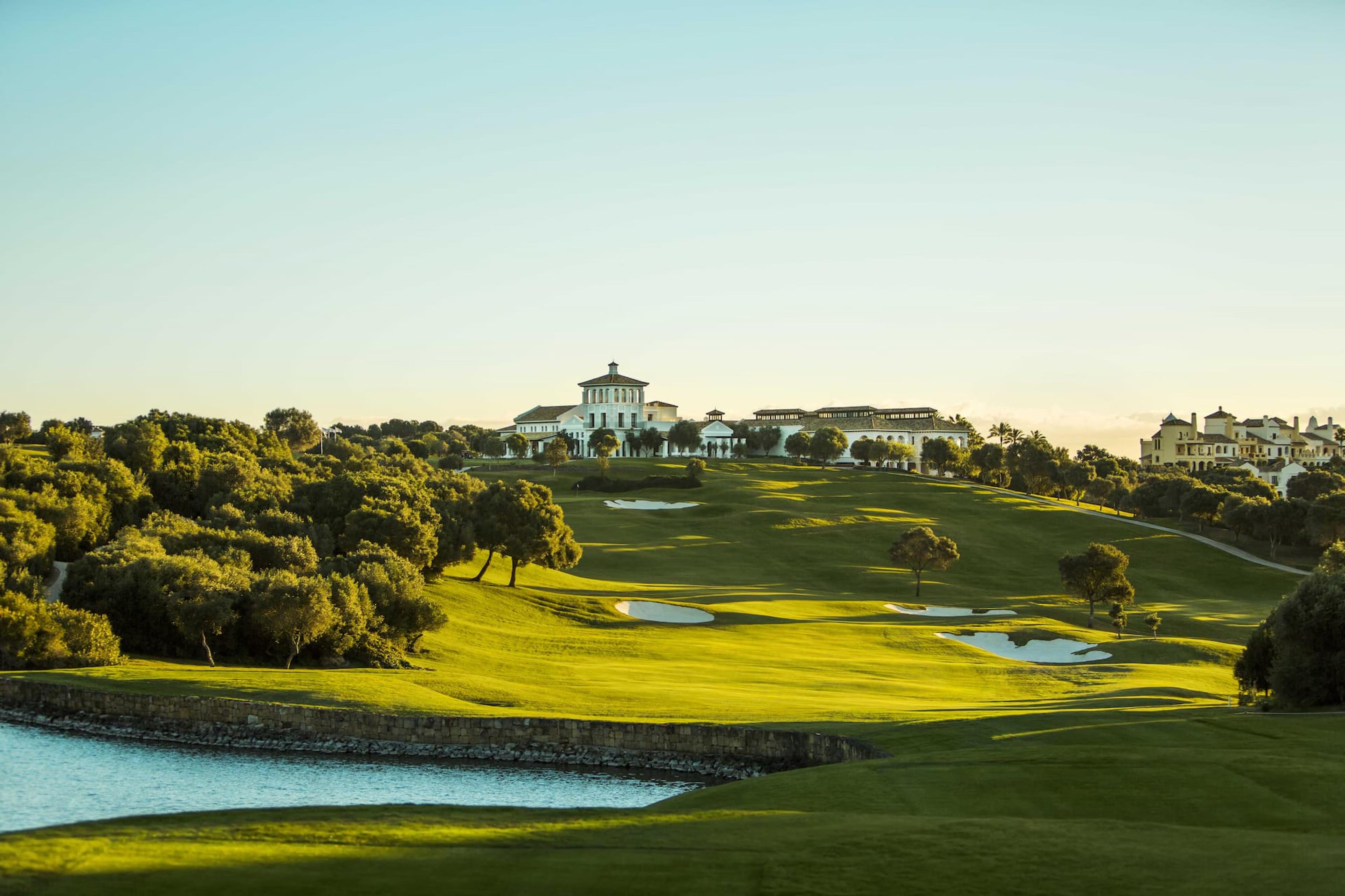 A well maintained fairway under clear blue skies