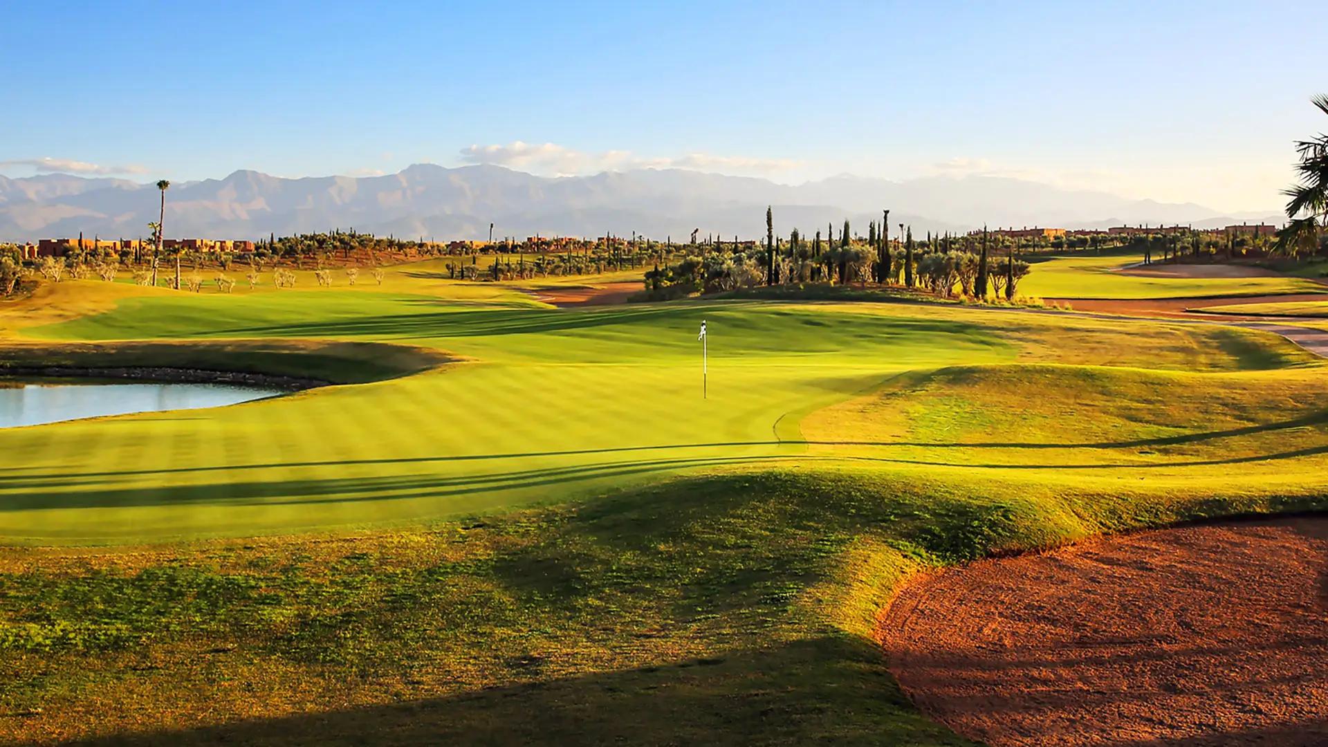A well maintained fairway under clear blue skies