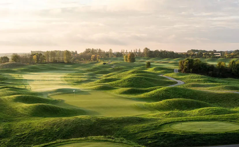 A well maintained fairway surrounded by rolling dunes