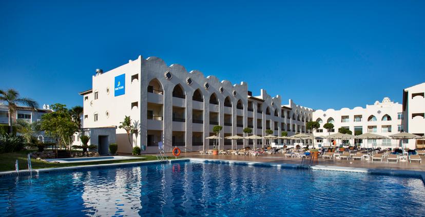 Panoramic view of the Hotel MAC Puerto Marina building overlooking the outdoor pool