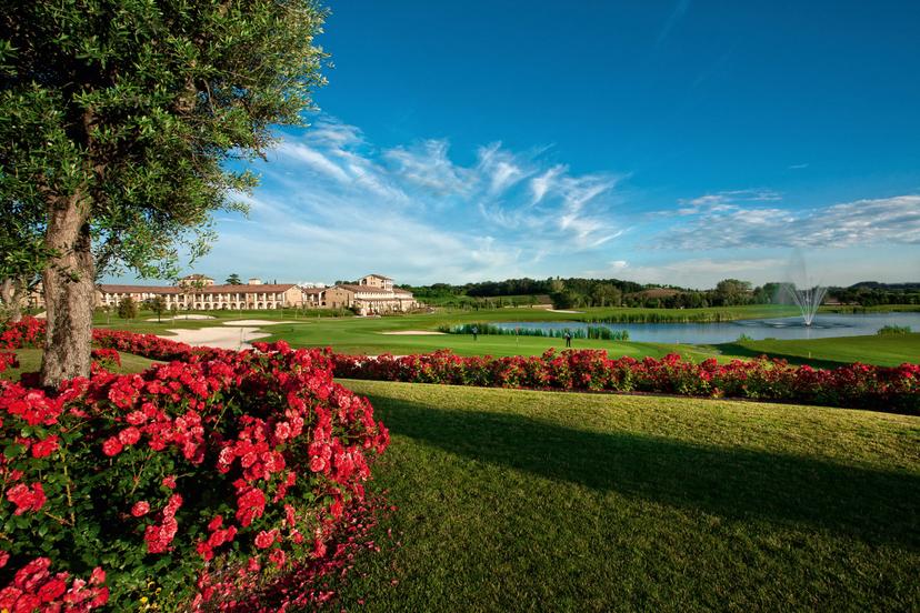 Panoramic view of the clubhouse overlooking the course at Chervò Golf Hotel Spa & Resort