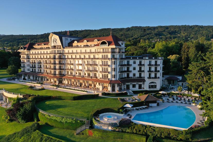 Panoramic view of Hotel Royal Evian Resort overlooking its outdoor pool